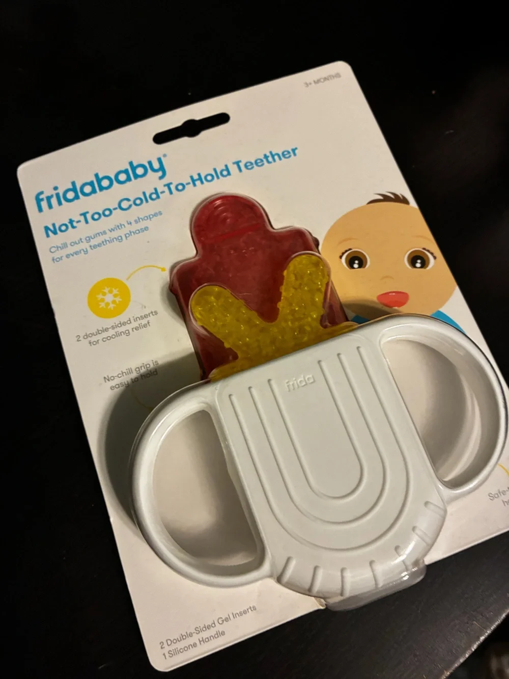 fridababy Not-Too-Cold-To-Hold Teether - White Handle with Red & Yellow Inserts